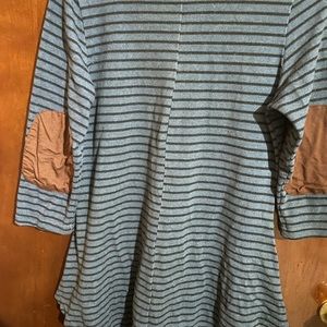 Blue and black striped tunic elbow patch detail